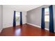 Cozy bedroom featuring wood floors and ample natural light at 3279 Fairfield Dr, Kissimmee, FL 34743