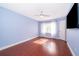 Well-lit bedroom with wood floors and a ceiling fan at 3279 Fairfield Dr, Kissimmee, FL 34743