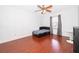 Bright bedroom with wood floors and a window at 3279 Fairfield Dr, Kissimmee, FL 34743