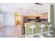 Modern kitchen with light wood cabinets, granite countertops, and breakfast bar at 3279 Fairfield Dr, Kissimmee, FL 34743
