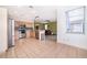 Modern kitchen with light wood cabinets, granite countertops, and stainless steel appliances at 3279 Fairfield Dr, Kissimmee, FL 34743