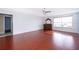 Main bedroom with hardwood floors and large window at 3279 Fairfield Dr, Kissimmee, FL 34743