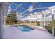 Enclosed pool area with patio and lake view at 3279 Fairfield Dr, Kissimmee, FL 34743