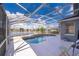Relaxing screened pool and spa overlooking the lake at 3279 Fairfield Dr, Kissimmee, FL 34743