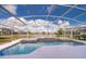 Screened pool and spa with lake view at 3279 Fairfield Dr, Kissimmee, FL 34743