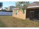 Screened patio and grassy backyard with a white vinyl fence at 428 Palastro Ave, Auburndale, FL 33823