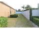 Grass backyard with a white vinyl fence at 428 Palastro Ave, Auburndale, FL 33823