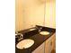 Bathroom with double vanity and granite countertop at 428 Palastro Ave, Auburndale, FL 33823