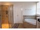 Spa-like bathroom with a large soaking tub and walk-in shower at 428 Palastro Ave, Auburndale, FL 33823