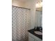 Bathroom with shower/tub combo and granite vanity at 428 Palastro Ave, Auburndale, FL 33823