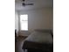 Bedroom with a full-size bed, window, and ceiling fan at 428 Palastro Ave, Auburndale, FL 33823