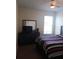 Bedroom featuring a double bed, dresser, and window at 428 Palastro Ave, Auburndale, FL 33823