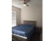 Bright bedroom with a king-size bed and wood-look flooring at 428 Palastro Ave, Auburndale, FL 33823