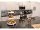 Modern kitchen features granite countertops and stainless steel appliances at 428 Palastro Ave, Auburndale, FL 33823