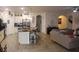 Open concept kitchen with large island and Gathering room view at 428 Palastro Ave, Auburndale, FL 33823