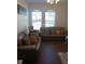 Living room with two sofas and wood-look flooring at 428 Palastro Ave, Auburndale, FL 33823