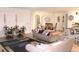 Bright and airy living room with comfortable furniture and large windows at 428 Palastro Ave, Auburndale, FL 33823
