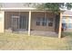 Details of the screened patio with a door and windows at 428 Palastro Ave, Auburndale, FL 33823