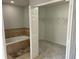 Bathroom with a bathtub and a walk-in closet at 433 Eastbridge Dr, Oviedo, FL 32765