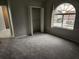 Spacious bedroom with carpeted floors and large window at 433 Eastbridge Dr, Oviedo, FL 32765