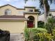 Two-story house with a two-car garage and manicured landscaping at 433 Eastbridge Dr, Oviedo, FL 32765