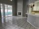 Living room with fireplace, pool view, and tile flooring at 433 Eastbridge Dr, Oviedo, FL 32765