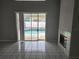 Living room with sliding doors leading to the pool at 433 Eastbridge Dr, Oviedo, FL 32765
