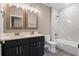 Modern bathroom with double vanity and marble shower at 510 Palm Ave, Eustis, FL 32726