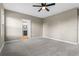 Comfortable bedroom with ceiling fan and ensuite bathroom access at 510 Palm Ave, Eustis, FL 32726