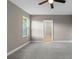 Bright bedroom with ceiling fan and access to bathroom at 510 Palm Ave, Eustis, FL 32726
