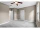 Bright bedroom with ceiling fan and carpet flooring at 510 Palm Ave, Eustis, FL 32726