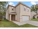 Two-story house with a white garage door and red front door at 510 Palm Ave, Eustis, FL 32726