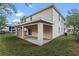 Two-story house with covered patio and backyard at 510 Palm Ave, Eustis, FL 32726