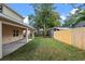 Two-story house with covered patio and fenced yard at 510 Palm Ave, Eustis, FL 32726