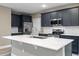 Modern kitchen with stainless steel appliances and an island at 510 Palm Ave, Eustis, FL 32726