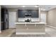 Modern kitchen with stainless steel appliances and an island at 510 Palm Ave, Eustis, FL 32726