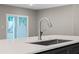 Modern kitchen sink and faucet with white countertop at 510 Palm Ave, Eustis, FL 32726