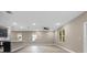 Spacious living room with tile floors and ceiling fan at 510 Palm Ave, Eustis, FL 32726