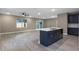 Open living room and kitchen with tile floors at 510 Palm Ave, Eustis, FL 32726