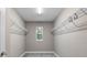 Large walk-in closet with double hanging rods and window at 510 Palm Ave, Eustis, FL 32726