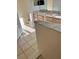 Bathroom with double vanity, marble countertop, and tiled floors at 1005 Chase Dr, Winter Garden, FL 34787