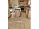 Kitchen with light wood cabinets, an island, and tile flooring at 1005 Chase Dr, Winter Garden, FL 34787