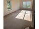 Living room with carpeted floors and large windows at 1005 Chase Dr, Winter Garden, FL 34787