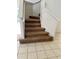 Indoor staircase with carpeted steps and neutral-colored walls at 1005 Chase Dr, Winter Garden, FL 34787