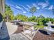Landscaped backyard with patio and canal view at 110 Coleman St, Edgewater, FL 32141