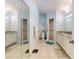 Main bathroom with dual sinks, walk-in shower, and large mirror at 110 Coleman St, Edgewater, FL 32141
