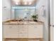 Bathroom with granite vanity and large mirror at 110 Coleman St, Edgewater, FL 32141