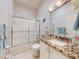Bathroom with tub, shower, and granite vanity at 110 Coleman St, Edgewater, FL 32141