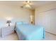 Guest bedroom with a queen-size bed and ample closet space at 110 Coleman St, Edgewater, FL 32141
