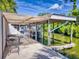 Covered boat dock with lift and seating area at 110 Coleman St, Edgewater, FL 32141